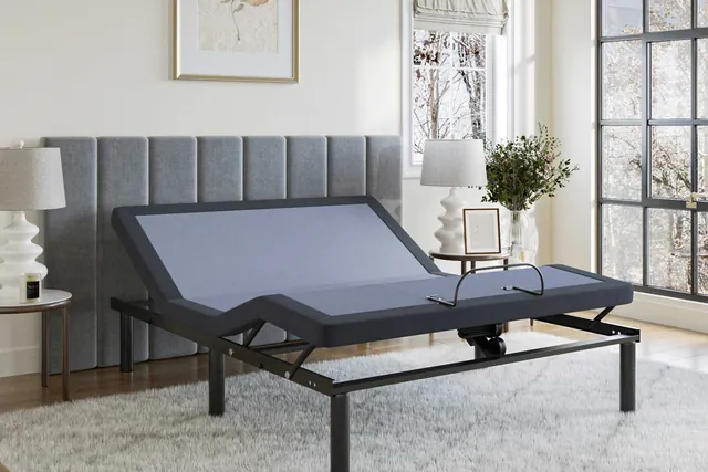 BedTech BT2500 adjustable bed base with the head and foot raised in a bedroom