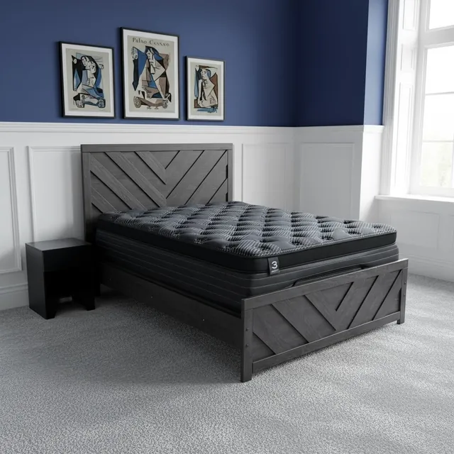 Comfort Bedding mattress with a black quilted top on a gray chevron wood bed