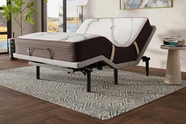 Ergo-Pedic CoreLift + Massage Comfort Lounger adjustable base with the head and foot raised under a mattress
